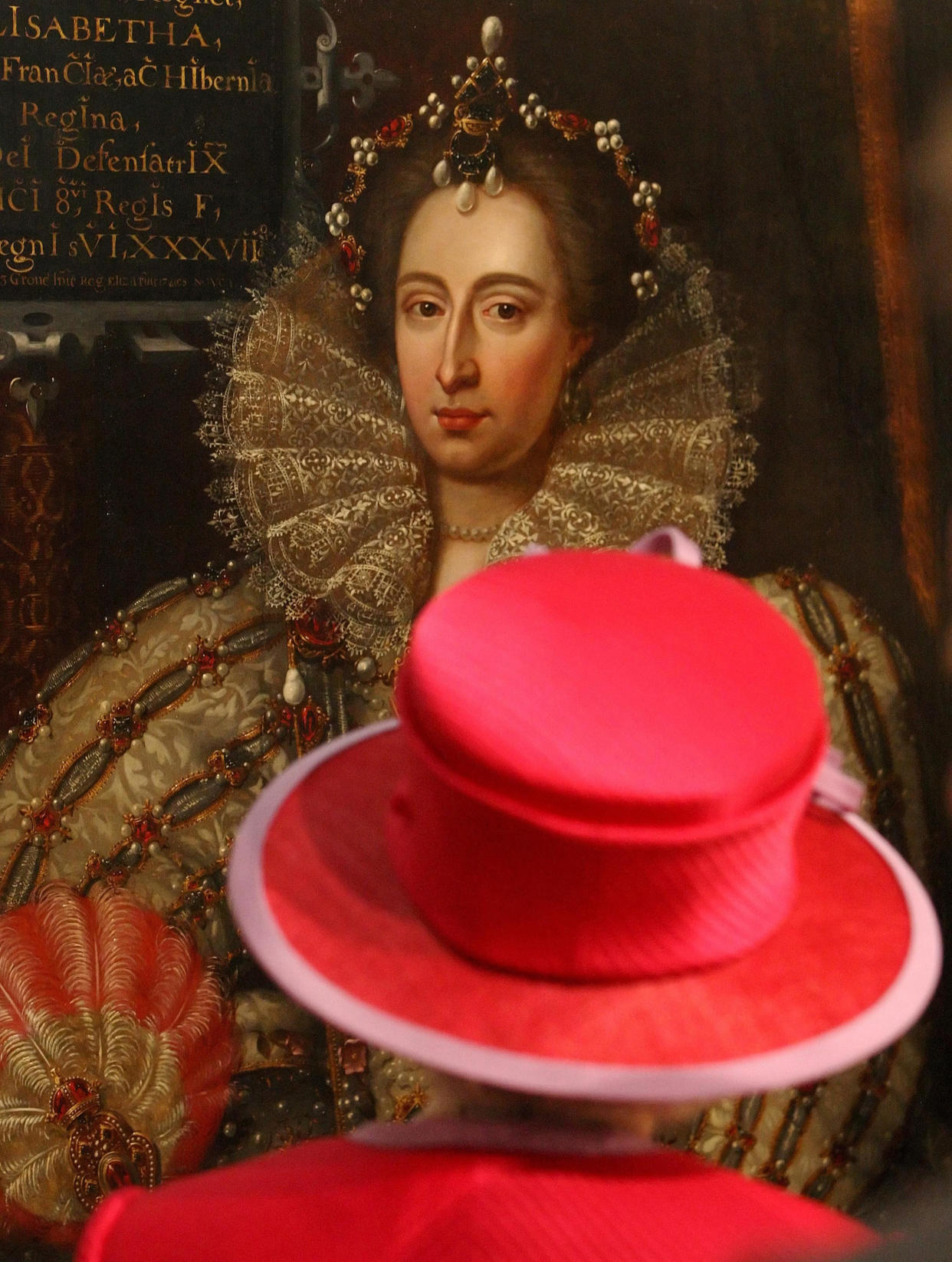 Britain's Queen Elizabeth II looks at a portrait of Queen Elizabeth I during a visit to Westminster Abbey and Westminster School in London May 21, 2010. The visit marked the 450th anniversary of the granting of the institution's Royal Charter by Queen Elizabeth I.   REUTERS/Dominic Lipinski/Pool  (BRITAIN - Tags: ROYALS RELIGION ANNIVERSARY)