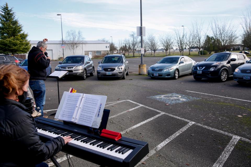 Chemeketa Community College choir students gather for "Car Choir" on Thursday in Salem, Ore. The concept allows students to sing as a group through microphones from the comfort of their vehicles to prevent the spread of COVID-19.