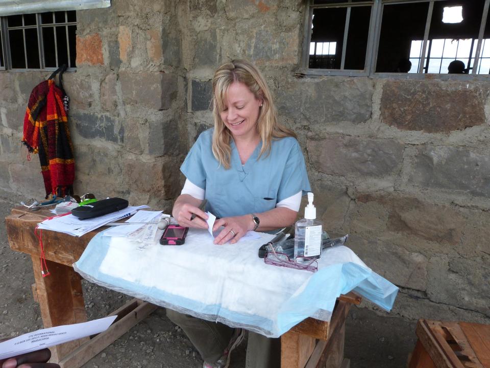 Dr. Karen Keough sets up her station to receive families at Ubuntu Life clinic in Kenya.