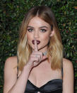 <p>She has seven tattoos, and the lowercase <i>A</i> on her index finger stands for the first initial of her character name, Aria Montgomery, on <em>Pretty Little Liars</em>. (Photo: Getty Images) </p>