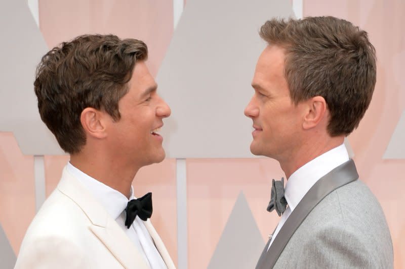 Neil Patrick Harris (R) and David Burtka attend the Academy Awards in 2015. File Photo by Kevin Dietsch/UPI