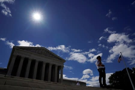 FILE PHOTO: An officer keeps watch at the U.S. Supreme Court in Washington