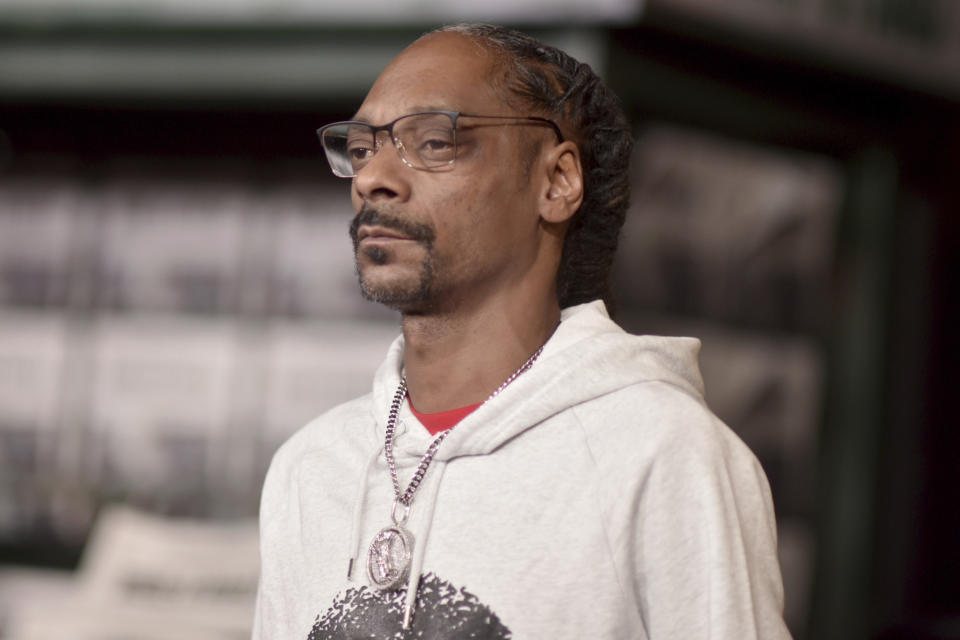 FILE - In this Thursday, Oct. 24, 2019 file photo, Snoop Dogg arrives at the Los Angeles premiere of "The Irishman," at the TCL Chinese Theatre. On Saturday, Feb. 8, 2020, the CBS News chief called threats against journalist Gayle King “reprehensible” as backlash grew against rapper Snoop Dogg and others critical of King for an interview where she asked about a sexual assault charge against the late Kobe Bryant. (Photo by Richard Shotwell/Invision/AP)