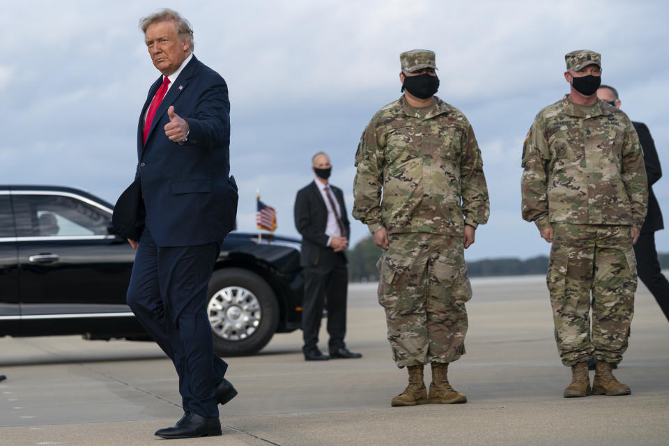 President Donald Trump gives a thumbs up after arriving at Pope Army Field for an event with troops at Fort Bragg, Thursday, Oct. 29, 2020, in Pope Field, N.C. (AP Photo/Evan Vucci)