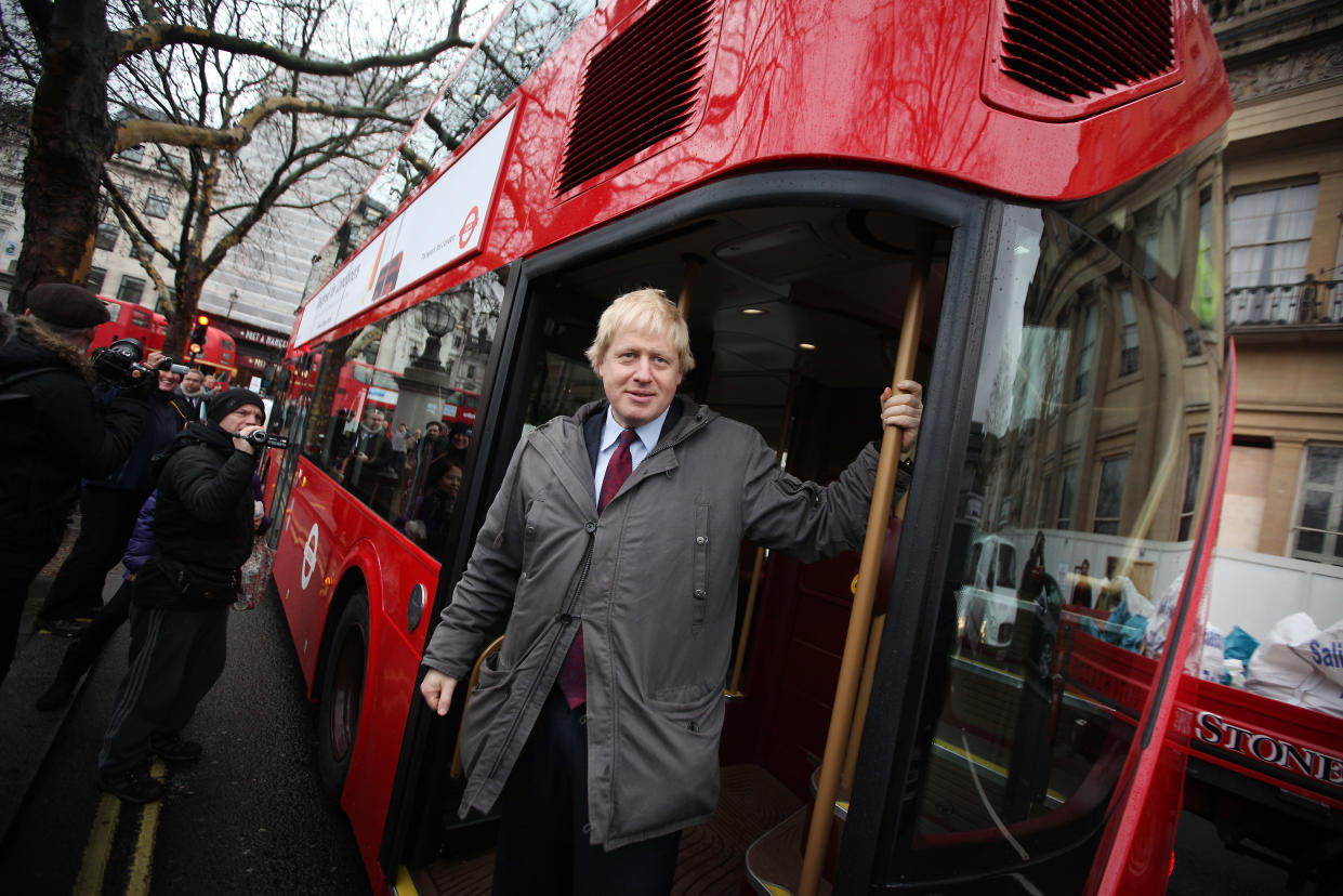 Boris Johnson on a Routemaster bus in 2011. He has claimed to unwind by making model buses out of wine crates. (Getty)