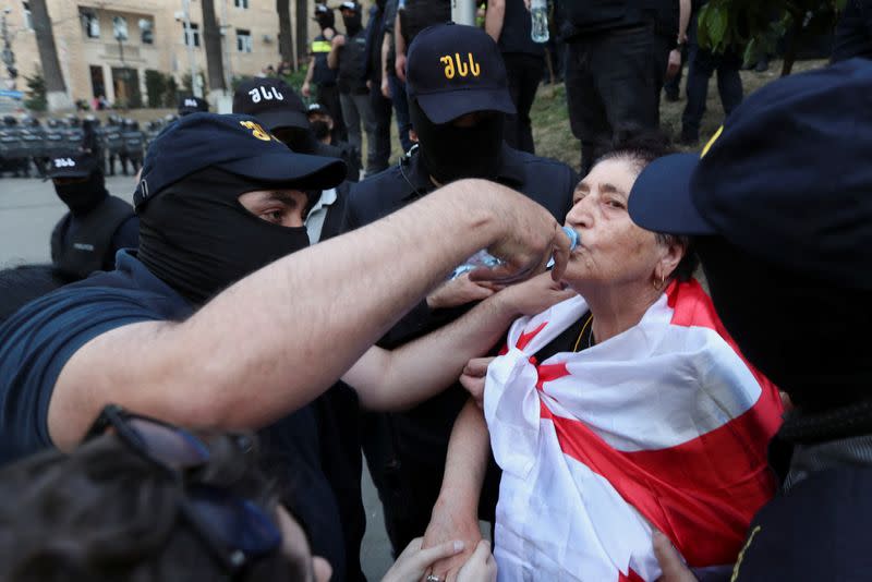 Demonstrators hold a rally to protest against a bill on "foreign agents", in Tbilisi