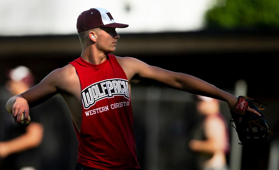 Western Christian senior Ty Van Essen warms up during practice at the high school on June 16 in Hull.