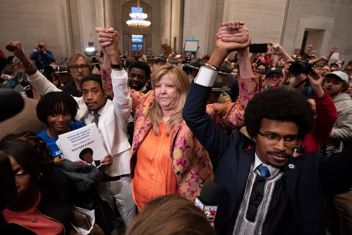 Former Rep Justin Jones, Rep Gloria Johnson and former Rep Justin Pearson raise their hands outside the House chamber after Jones and Pearson were expelled from the legislature (Copyright 2023 The Associated Press. All rights reserved)