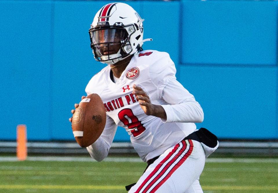 Austin Peay quarterback Draylen Ellis (9) looks for an open teammate while playing against Tennessee State at Nissan Stadium on Nov. 13, 2021.