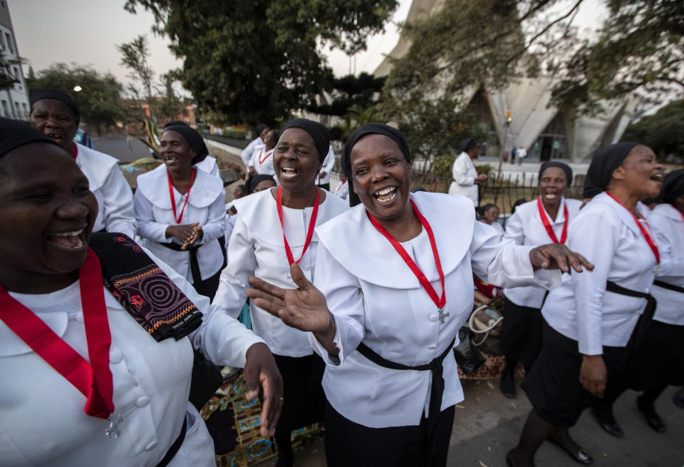 Women from different churches sing as they wait to see Pope Francis, ahead of his arrival at the Apostolic Nunciature in the capital Maputo, Mozambique Wednesday, Sept. 4, 2019. Pope Francis is opening a three-nation pilgrimage to southern Africa with a strategic visit to Mozambique, just weeks after the country's ruling party and armed opposition signed a new peace deal and weeks before national elections. (AP Photo/Ben Curtis)