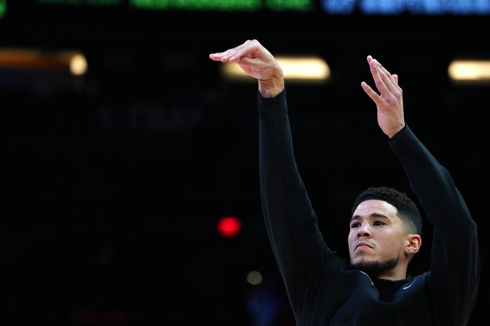 May 4, 2022; Phoenix, Arizona; USA; Suns' Devin Booker (1) warms up prior to Game 2 in the second round of the Western Conference Playoffs against the Mavericks.