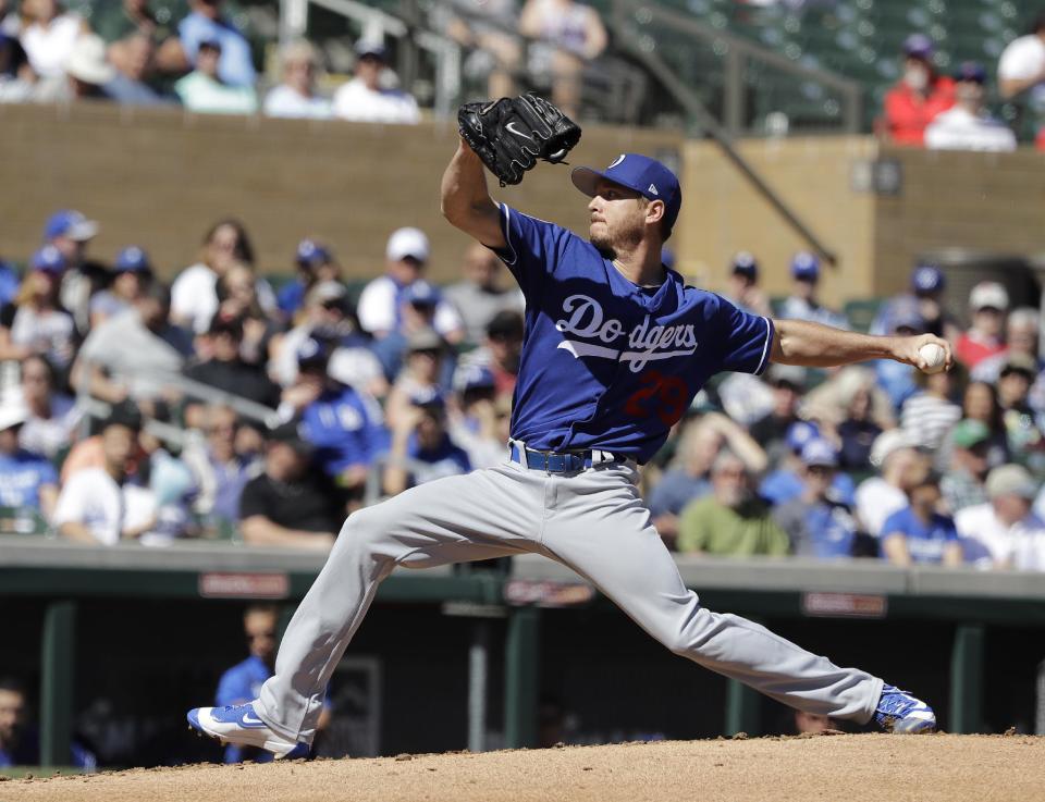Los Angeles Dodgers' Scott Kazmir throws during the first inning of a spring training baseball game against the Colorado Rockies, Monday, March 6, 2017, in Scottsdale, Ariz. (AP Photo/Darron Cummings)