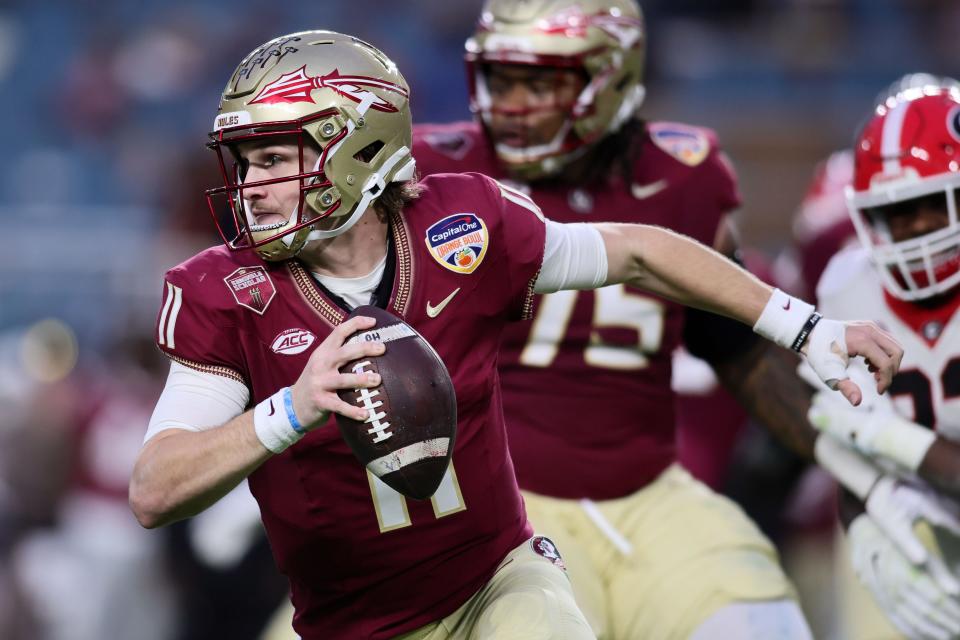 Florida State Seminoles quarterback Brock Glenn (11) runs with the ball against the Georgia Bulldogs during the first half December 30, 2023, in the 2023 Orange Bowl at Hard Rock Stadium in Miami Gardens, Florida.