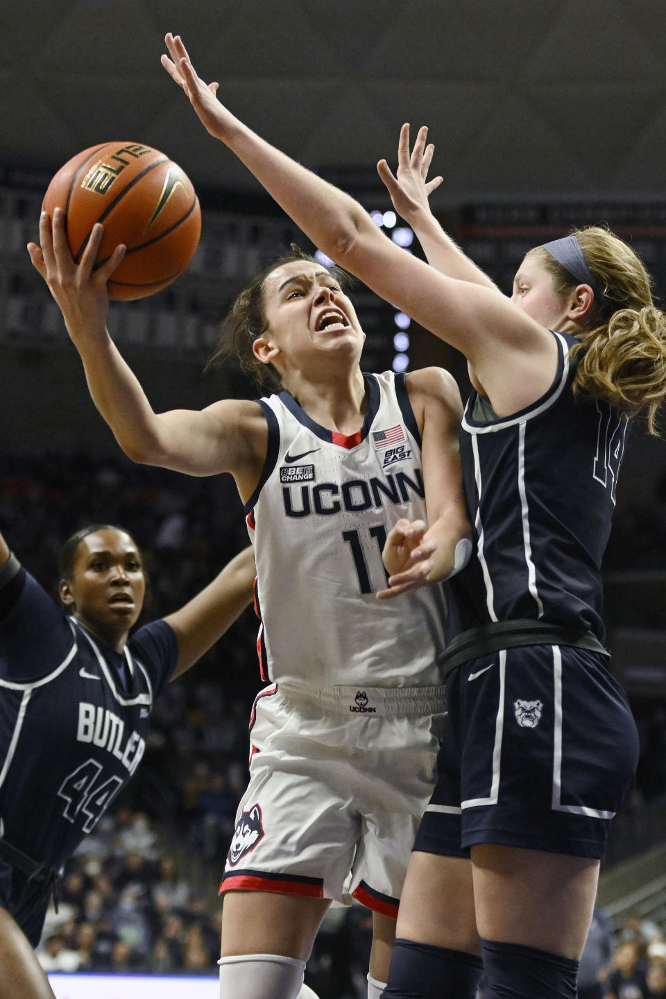 UConn's Lou Lopez-Senechal, left, shoots over Butler's Rachel McLimore in the first half of an NCAA college basketball game, Saturday, Jan. 21, 2023, in Storrs, Conn. (AP Photo/Jessica Hill)