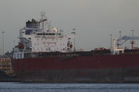 The Nave Andromeda oil tanker is docked next to the Queen Elizabeth II Cruise Terminal in Southampton, England, Monday, Oct. 26, 2020. The U.K. military seized control of the oil tanker that dropped anchor in the English Channel after reporting it had seven stowaways on board who had become violent. (Andrew Matthews/PA Wire via AP)