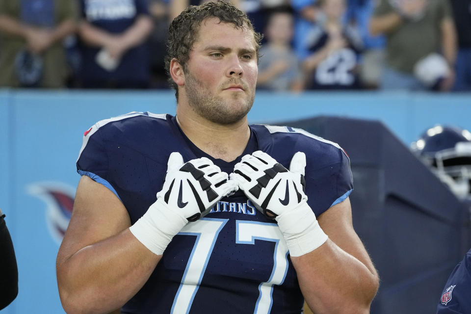 Tennessee Titans offensive lineman Peter Skoronski (77) stands on the sideline before before an NFL preseason football game against the New England Patriots, Saturday, Aug. 26, 2023, in Nashville, Tenn. The Titans are coming off their best offensive performance as they prepare for their first AFC South game at Indianapolis. Now coach Mike Vrabel has some decisions to make as Skoronski, their top draft pick and starting left guard, returns to practice from an appendectomy. (AP Photo/George Walker IV, File0