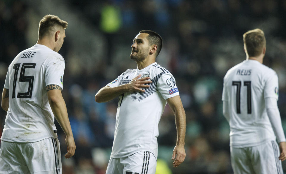 Germany's İlkay Gundogan, centre, celebrates after scoring his side's first goal during the Euro 2020 group C qualifying soccer match between Estonia and Germany at the A. Le Coq Arena in Tallinn, Estonia, Sunday, Oct. 13, 2019. (AP Photo/Raul Mee)