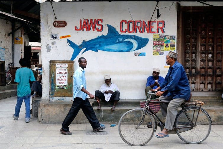 <span class="caption">A narrow street in Zanzibar, Tanzania, where Gurnah was born.</span> <span class="attribution"><a class="link " href="https://www.alamy.com/stock-photo-people-in-a-narrow-street-in-stonetown-zanzibar-tanzania-53418378.html?pv=1&stamp=2&imageid=BA9889F9-18B6-4140-87EB-027B36AE284A&p=27879&n=0&orientation=0&pn=1&searchtype=0&IsFromSearch=1&srch=foo%3dbar%26st%3d0%26pn%3d1%26ps%3d100%26sortby%3d2%26resultview%3dsortbyPopular%26npgs%3d0%26qt%3dZanzibar%26qt_raw%3dZanzibar%26lic%3d3%26mr%3d0%26pr%3d0%26ot%3d0%26creative%3d%26ag%3d0%26hc%3d0%26pc%3d%26blackwhite%3d%26cutout%3d%26tbar%3d1%26et%3d0x000000000000000000000%26vp%3d0%26loc%3d0%26imgt%3d0%26dtfr%3d%26dtto%3d%26size%3d0xFF%26archive%3d1%26groupid%3d%26pseudoid%3d447050%26a%3d%26cdid%3d%26cdsrt%3d%26name%3d%26qn%3d%26apalib%3d%26apalic%3d%26lightbox%3d%26gname%3d%26gtype%3d%26xstx%3d0%26simid%3d%26saveQry%3d%26editorial%3d%26nu%3d%26t%3d%26edoptin%3d%26customgeoip%3dGB%26cap%3d1%26cbstore%3d1%26vd%3d0%26lb%3d%26fi%3d2%26edrf%3d0%26ispremium%3d1%26flip%3d0%26pl%3d" rel="nofollow noopener" target="_blank" data-ylk="slk:Alamy;elm:context_link;itc:0;sec:content-canvas">Alamy</a></span>