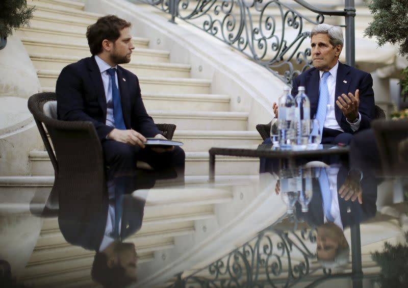 FILE PHOTO: U.S. Secretary of State John Kerry talks to State Department Chief of Staff Jon Finer during a meeting with members of the U.S. delegation at the garden of the Palais Coburg hotel where the Iran nuclear talks meetings are being held in Vienna,