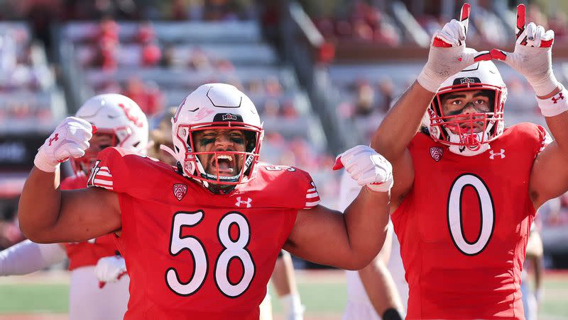 Utah Utes defensive tackle Junior Tafuna (58) and Utah Utes defensive end Logan Fano (0) celebrate a defensive stand against UCLA in Salt Lake City on Saturday, Sept. 23, 2023.