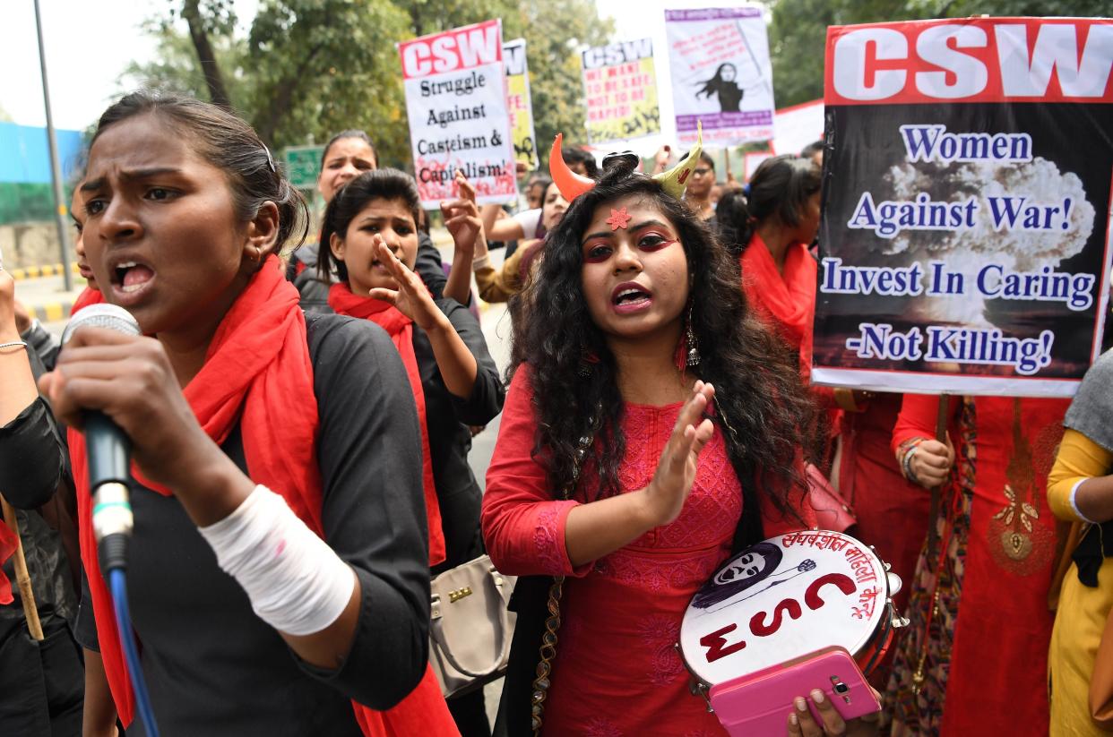 Indian women shout slogans at a march to mark International Women’s Day in New Delhi on March 8, 2019. A women from a scheduled tribe in India was beaten, stripped and paraded naked through the village for ‘having an extra-marital affair’ (AFP via Getty Images)