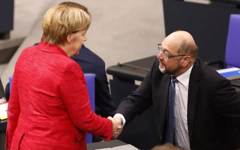 Angela Merkel speaks with Martin Schulz, the leader of the Social Democrats Party (SPD) - Credit:  Michele Tantussi/Getty Images Europe