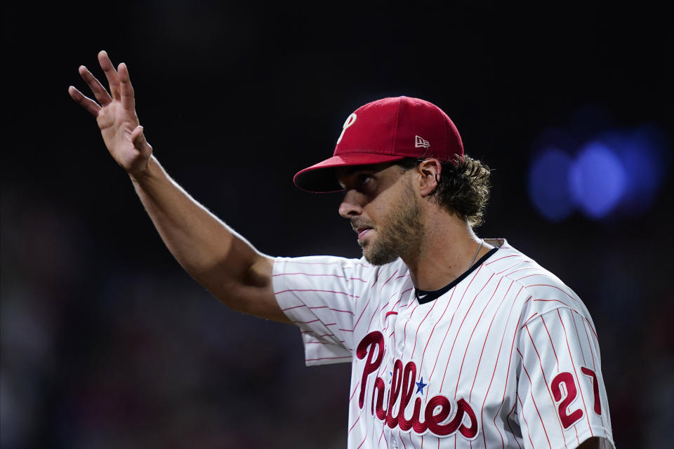 Philadelphia Phillies starting pitcher Aaron Nola (27) acknowledges fans after bring relieved during the seventh inning in Game 3 of baseball's National League Division Series against the Atlanta Braves, Friday, Oct. 14, 2022, in Philadelphia. (AP Photo/Matt Rourke)