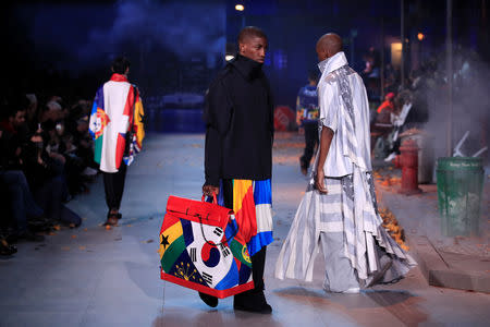 Models present creations by designer Virgil Abloh as part of his Fall/Winter 2019-2020 collection show for fashion house Louis Vuitton during Men's Fashion Week in Paris, France, January 17, 2019. REUTERS/Gonzalo Fuentes