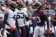 Houston Texans wide receiver Brandin Cooks (13) yells toward Chicago Bears' Eddie Jackson (4) and Nicholas Morrow (53) during the first half of an NFL football game Sunday, Sept. 25, 2022, in Chicago. (AP Photo/Nam Y. Huh)
