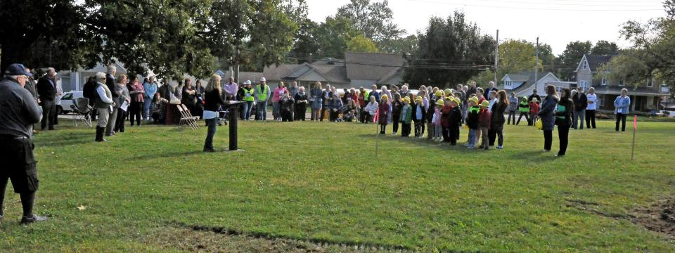 Ritman Library branch Manager Pam Schemrich addresses the nearly 100 people at a Friday groundbreaking ceremony for the new facility.