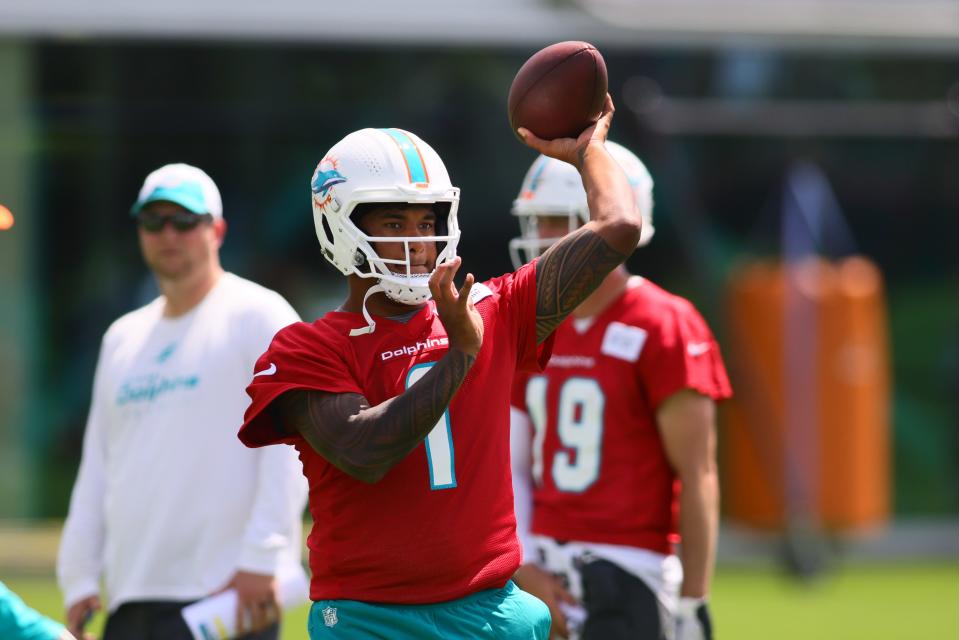 Jun 4, 2024; Miami Gardens, FL, USA; Miami Dolphins quarterback Tua Tagovailoa (1) throws the football during mandatory minicamp at Baptist Health Training Complex. Mandatory Credit: Sam Navarro-USA TODAY Sports