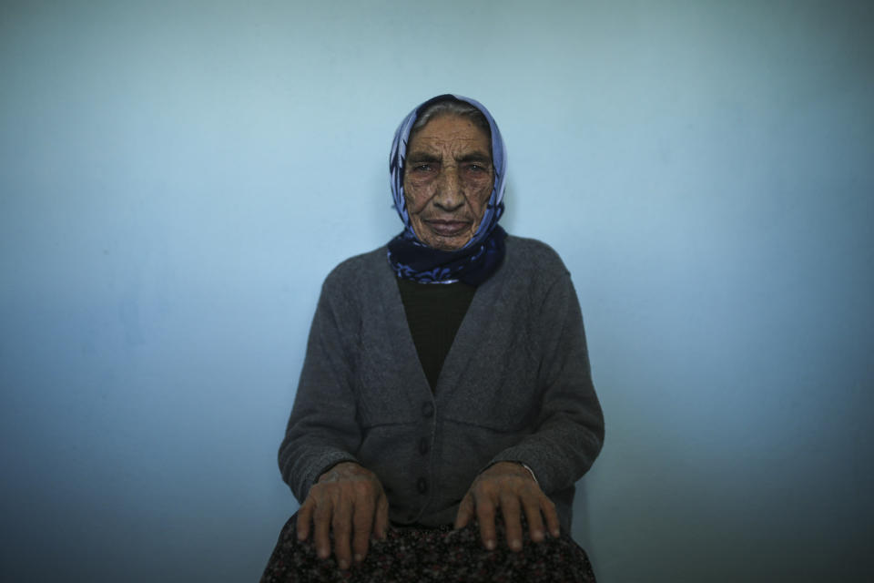 Altun Yigit, 83, rests after she was administered a CoronaVac vaccine made by China's Sinovac Biotech Ltd. by a visiting medical team at her house in the isolated village of Gumuslu of the district of Sivas, central Turkey, Friday, Feb. 26, 2021. (AP Photo/Emrah Gurel)