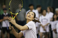 Two-time Grand Slam champion Li Na serves the ball during the tennis clinic she led at the Sutton East Tennis Club Thursday, July 18, 2019, in New York. Li Na will be inducted into the Tennis Hall of Fame on Saturday, July 20. (AP Photo/Kevin Hagen)