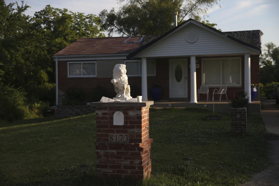 This Friday, June 26, 2020 photo, shows the front yard of a home in Kinloch, Mo. Authorities say a St. Louis rapper who went by the stage name of Huey has been killed in a double shooting at the suburban St. Louis home. Police identified him as 32-year-old Lawrence Franks Jr., although fans new him as Huey. A second victim remains hospitalized with non-life threatening injuries. (Laurie Skrivan/St. Louis Post-Dispatch via AP)