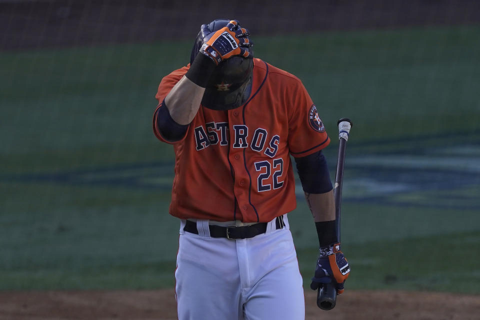 Houston Astros' Josh Reddick reacts after striking out against the Oakland Athletics during the eighth inning of Game 3 of a baseball American League Division Series in Los Angeles, Wednesday, Oct. 7, 2020. (AP Photo/Ashley Landis)