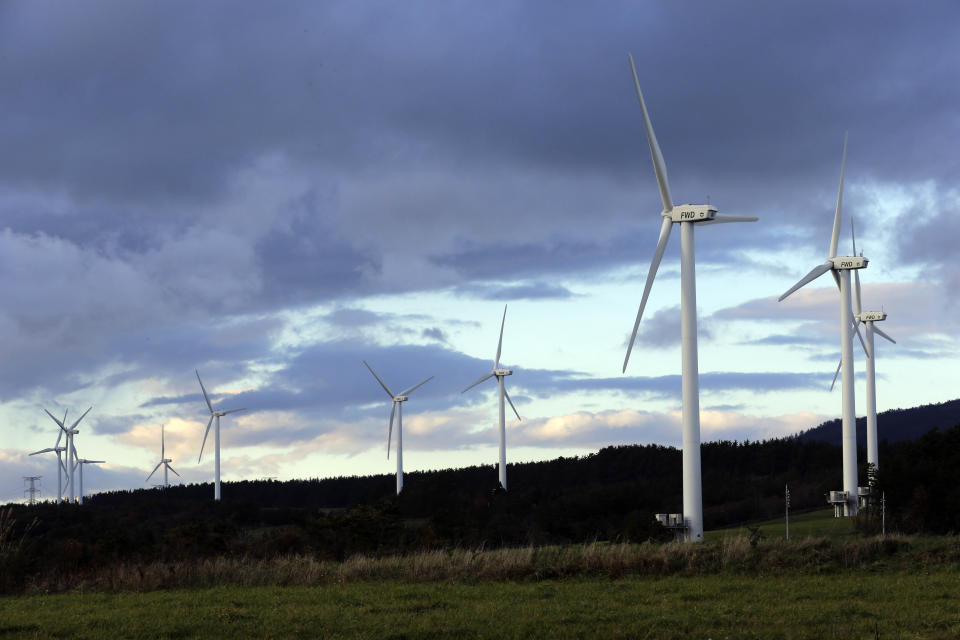 Wind turbines are seen in Rokkasho village, Aomori Prefecture, northern Japan on Nov. 8, 2012. Japan on Friday, Oct. 22, 2021, adopted a new energy policy that pushes for nuclear and renewables as sources of clean energy to achieve the country’s pledge of reaching carbon neutrality in 2050.(AP Photo/Koji Sasahara)