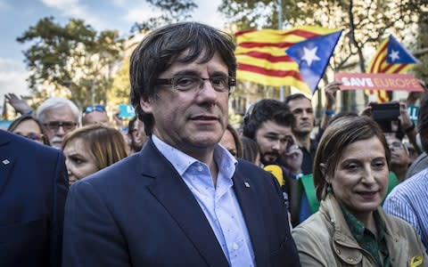 Mr Puigdemont led his governments into protests on Saturday - Credit: Bloomberg