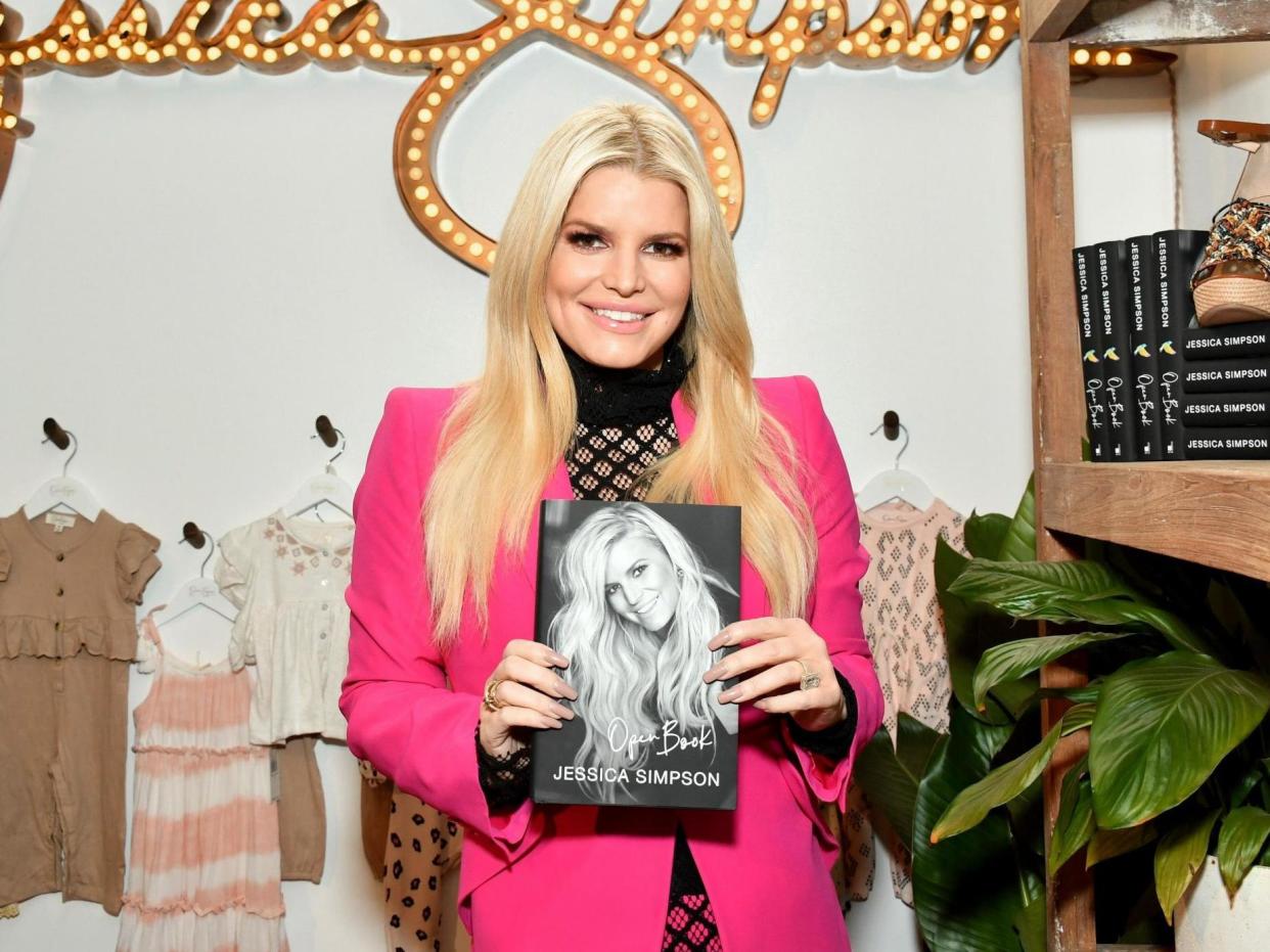 Jessica Simpson with a copy of her 'Open Book': Getty