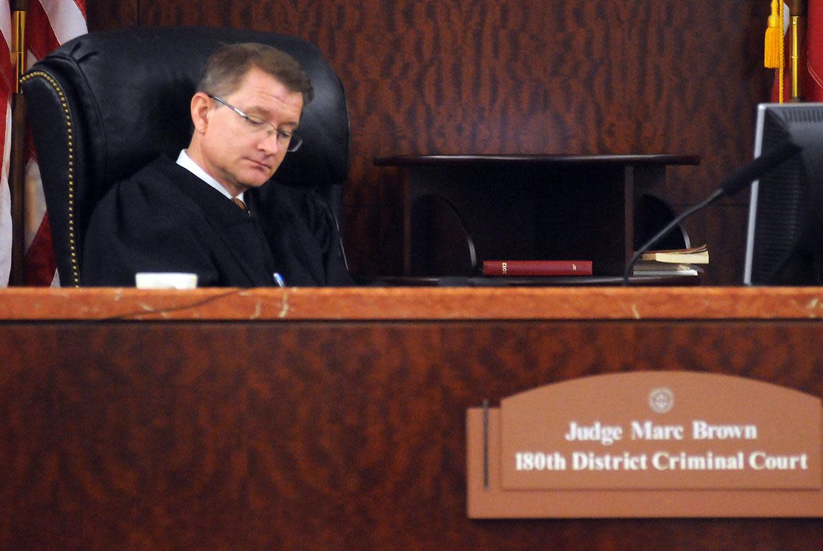 Judge Marc Brown listens to attorney Mike DeGeurin during Jessica Tata's pretrial hearings in the 180th state district court   Monday Oct. 15,2012.