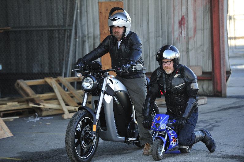 In this undated image released by Discovery Channel, Jamie Hyneman, left, and Adam Savage are shown in an episode from Discovery Channel's "Unchained Reaction." As in the Tortoise and the Hare fable, they illustrate that speed isn't always about size or how fast someone is traveling. In each episode, two five-person teams of engineers, designers and the like are given five days and a warehouse full of tools and materials to create a contraption based on a simple theme, such as "light vs. heavy" or "fire and ice." Then, Hyneman, Savage and a guest judge decide which one is the most inventive. The show premieres March 18, at 10 p.m. EST on Discovery. (AP Photo/Discovery Channel, Rahoul Ghose)