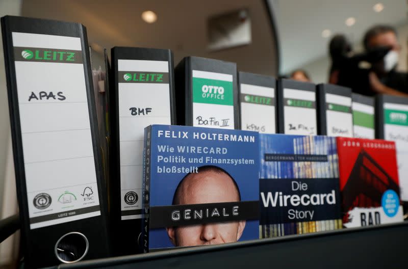 FILE PHOTO: Wirecard acts and books about the company are pictured, in Berlin