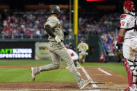 San Diego Padres' Juan Soto scores on a fielder's choice by Jake Cronenworth during the fourth inning in Game 3 of the baseball NL Championship Series between the San Diego Padres and the Philadelphia Phillies on Friday, Oct. 21, 2022, in Philadelphia. (AP Photo/Brynn Anderson)