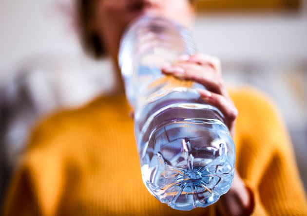 Bottled water may contain bacteria, plastic pieces and more if it's not thoroughly regulated or stored properly. (Photo: mikroman6 via Getty Images)