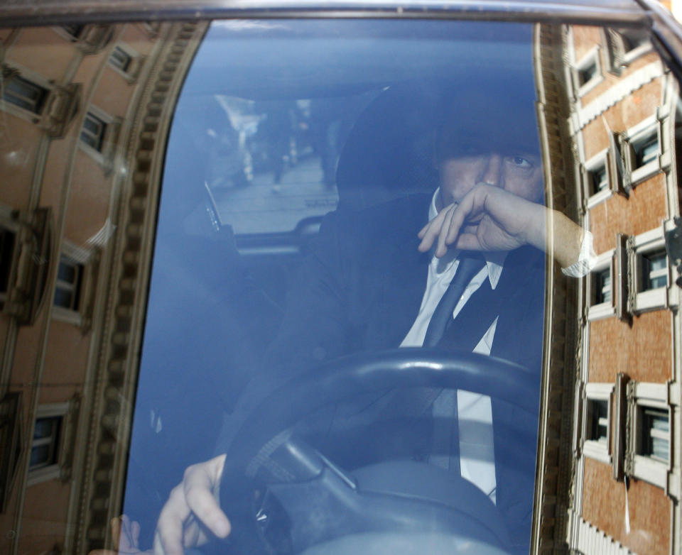 Florence Mayor and Italian center-left Democratic Party leader Matteo Renzi is framed by the reflection on the car window of Roman buildings as he leaves after a meeting with Premier Enrico Letta at Chigi Palace government office, in Rome, Wednesday, Feb. 12, 2014. Letta battled Wednesday to stay in office amid a power play by supporters of the dynamic head of his party, Renzi, to replace him as premier in the latest chapter to convulse Italy's fragile political stability. Renzi arrived at Letta's office at Palazzo Chigi for a make-or-break meeting ahead of a Democratic Party summit on Thursday that is expected to determine the government's next steps. (AP Photo/Riccardo De Luca)