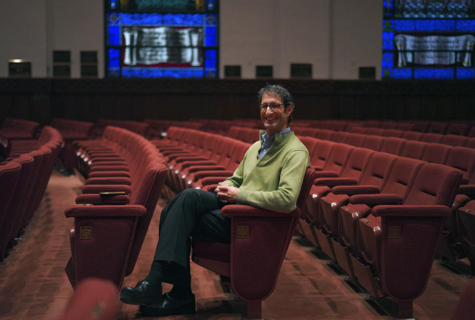 Senior Rabbi Seth Adelson sits for a portrait in the sanctuary at Congregation Beth Shalom in the Squirrel Hill neighborhood of Pittsburgh on Tuesday, Dec. 6, 2022. (AP Photo/Jessie Wardarski)