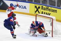 Matej Blumel of Czech Republic, back left, celebrates after scoring 1-0 behind goalkeeper Ben Bowns of Great Britain during the 2022 IIHF Ice Hockey World Championships preliminary round group B match between Czech Republic and Great Britain in Tampere, Finland, Saturday, May 14, 2022. (Emmi Korhonen/Lehtikuva via AP)