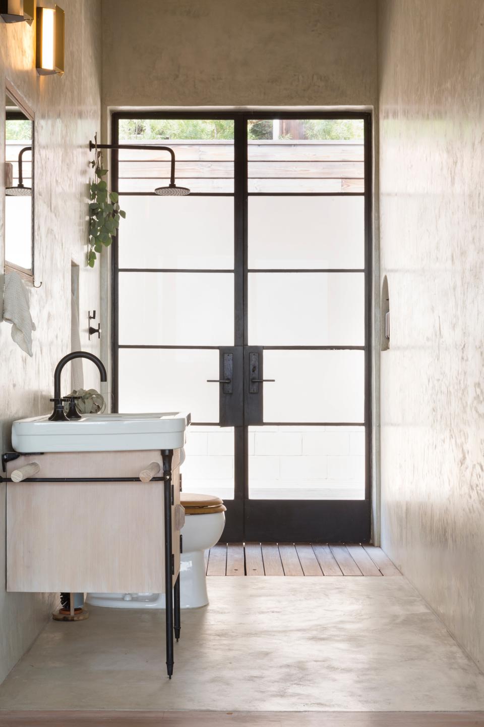 AFTER: “The sink console is custom-made from a vanity I found on Craigslist in Portland and brought down,” Grey says. “From the front it almost looks like a little guy with round arms, holding up a towel.”