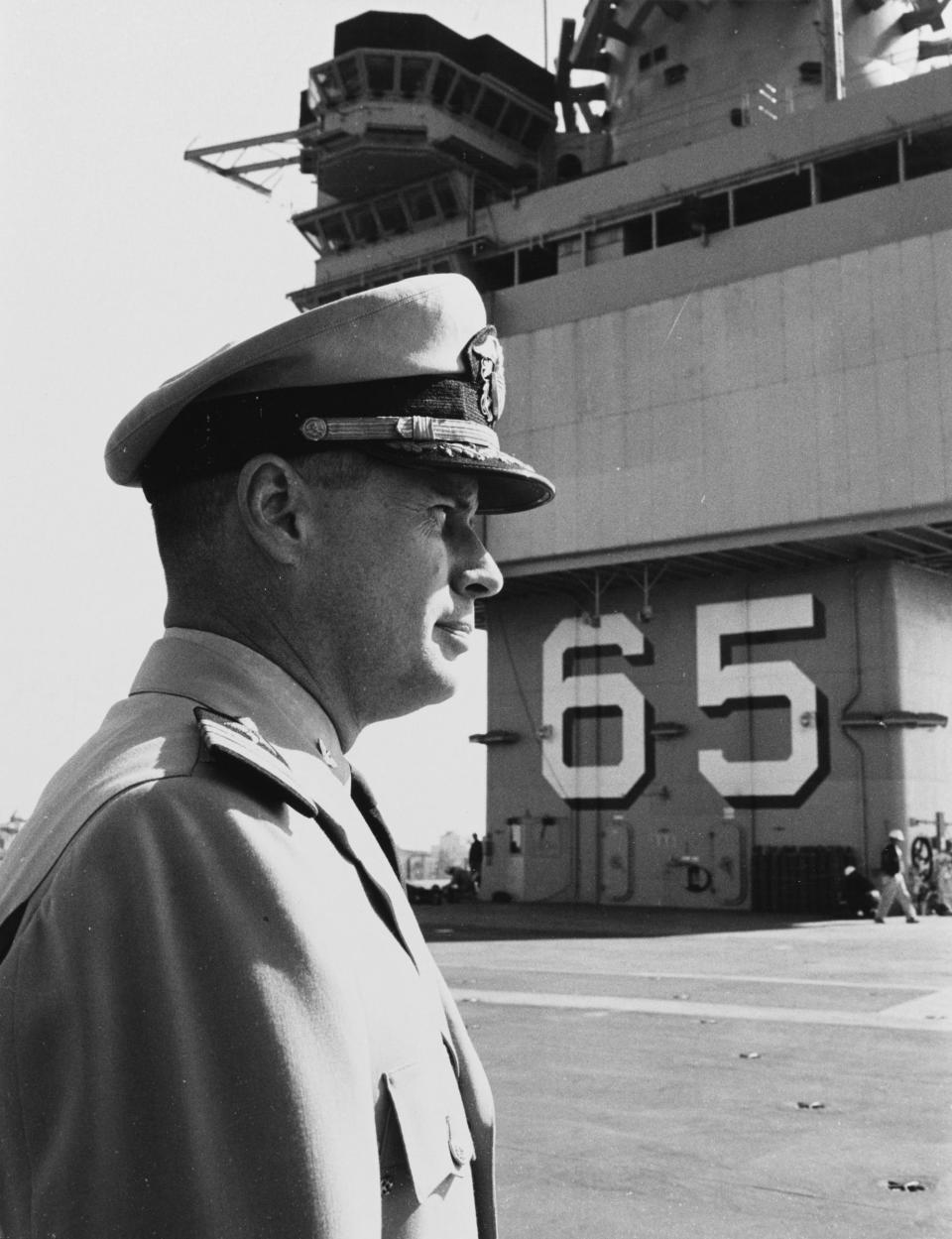 Capt. Vincent de Poix, the first commanding officer of USS Enterprise (CVAN 65), pictured on the flight deck of the carrier. As a young aviator in World War II, he flew combat missions from the deck of the first carrier named Enterprise.
