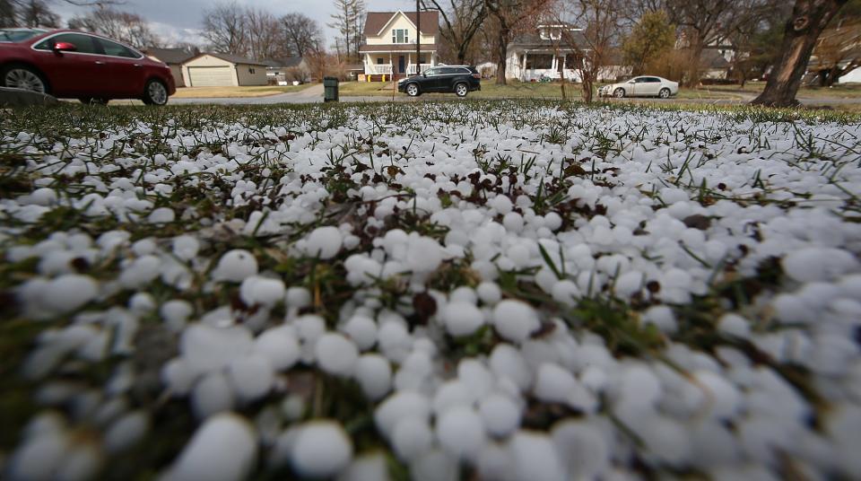 Hail pounded 12th Street in Ames as severe storm passed through on Friday, March 31, 2023.