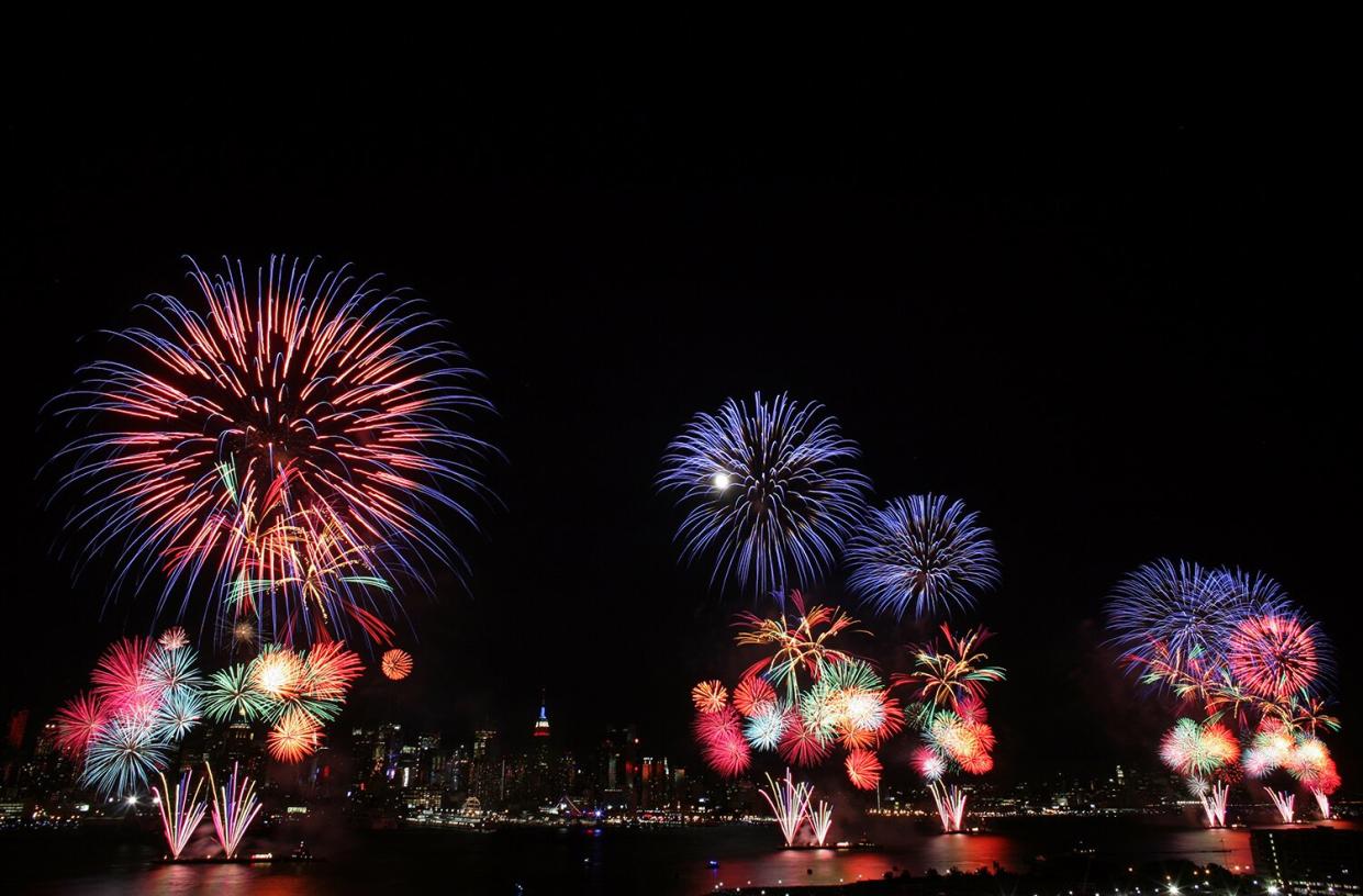 The New York City skyline is seen in the distance as fireworks explode over the Hudson River during the Macy's fireworks display July 4, 2009 in Weehawken, New Jersey. It was the first time since 2000 that the Macy's display took place over the Hudson River and not the East River.